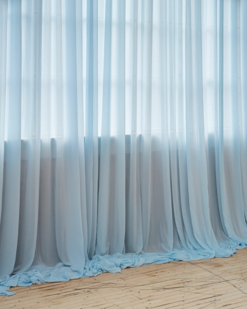 Blue curtain touches floor