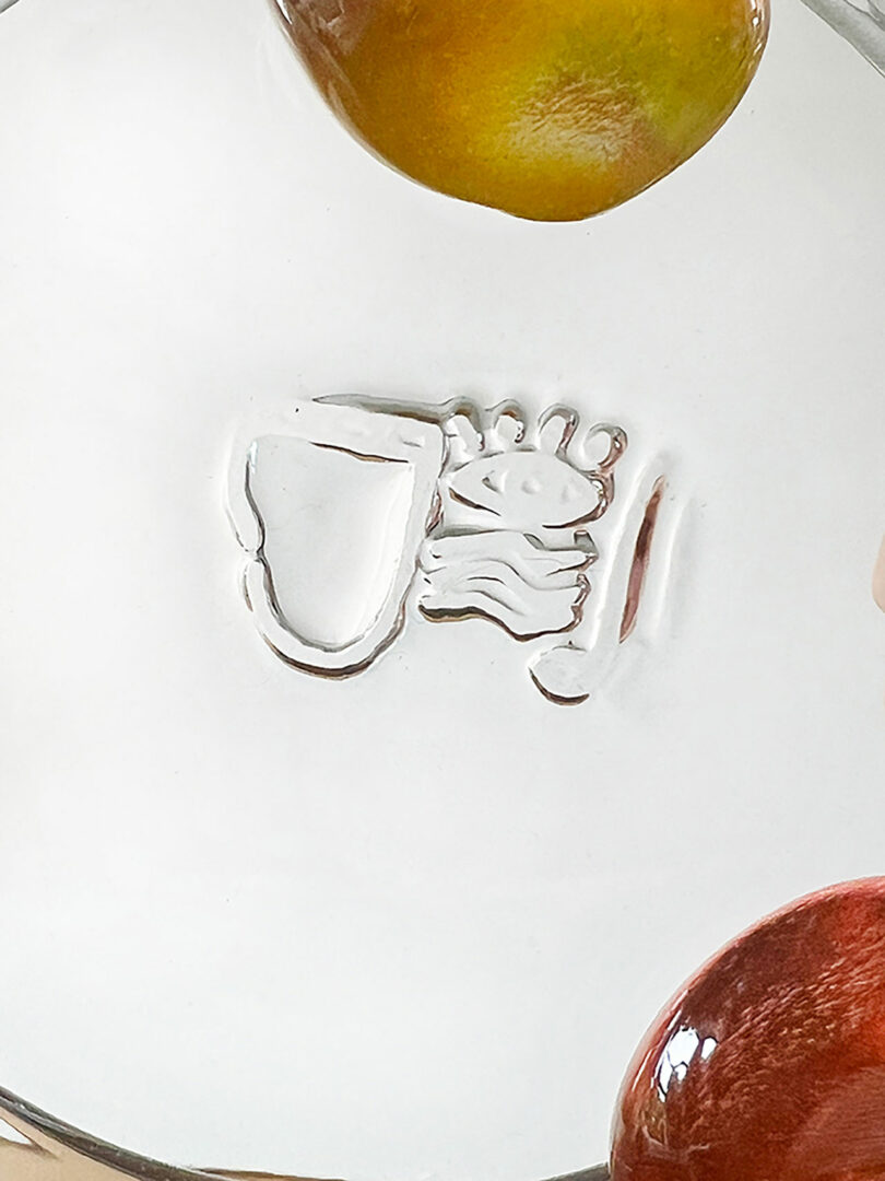 A glass surface with an imprint of Jess Humphrey's logo.